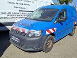 a blue van that is parked next to a white van