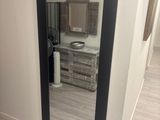 a large mirror in the corner of a room