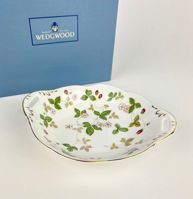 the bowl is sitting on the table next to the box