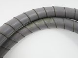 a close up of a gray hose on a white surface