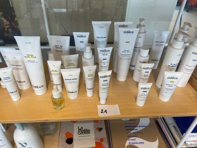 many different types of skin care products displayed on a shelf