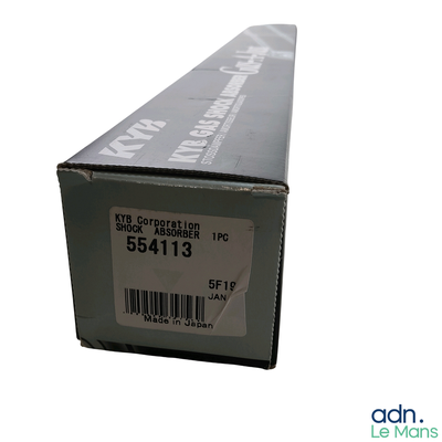 a box with a label on it sitting on a white surface