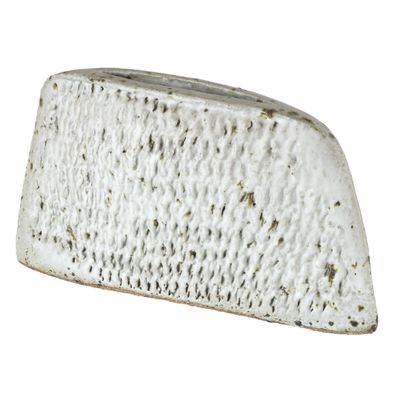 a piece of cheese that is sitting on a white surface
