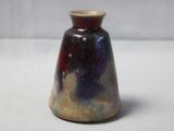 a small vase that is sitting on a table