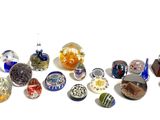 a lot of different colored glass beads on a white surface