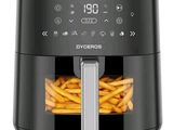 a close up of an air fryer with french fries in it
