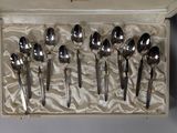 several spoons and spoon spoons are in a box on a table