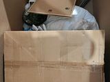 a cardboard box with a laptop in it sitting in a box