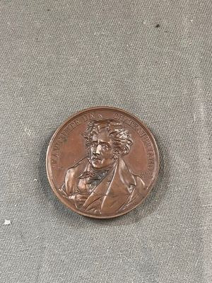 a coin that has a picture of a man on it
