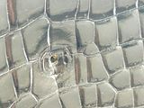 a close up picture of a metal object with a hole in the middle of it