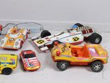 a lot of toy cars that are sitting on the floor