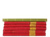a stack of red and green books sitting on top of each other