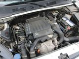 the engine of a car with its hood open and the hood open