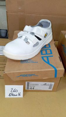 two boxes of shoes that are sitting on top of each other