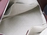 a purse that has a zipper on the inside of it