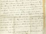 une lettre écrite à l'encre noire sur une feuille de papier