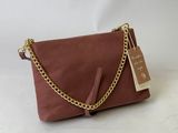 a brown leather purse with a gold chain and a tag on it