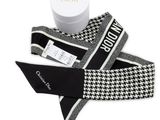 a picture of a black and white scarf and a white box