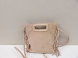 beige sued bag with fringes and a handle on a white surface