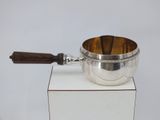 silver plated saucepan with wooden handle on white box