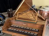 a piano that is sitting in the middle of a room