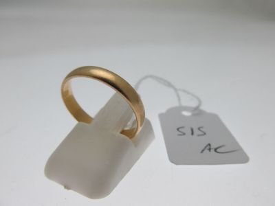 a gold ring with a price tag attached to it