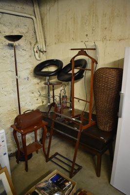 a white refrigerator and a brown chair in a room