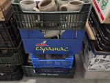 many boxes and crates with cups in them sitting on the floor