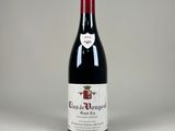 la bouteille de vin rouge est posée sur la table