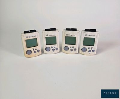 four electronic devices are lined up in a row on a white surface