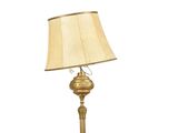 a lamp that is sitting on a table next to a lamp shade