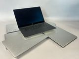 three laptops sitting on top of each other on a table