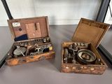 two wooden boxes that have different types of tools in them
