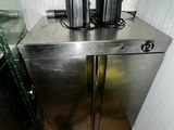 a metal cabinet with a pair of headphones on top of it