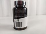 a bottle of vitamin supplement sitting on a table
