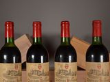 three bottles of wine sitting on top of a wooden table