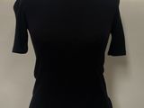 the top of a black shirt is on a mannequin mannequin