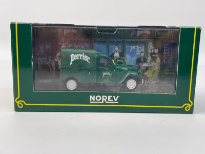 La boîte est verte et comporte l'image d'un camion vert.