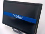 a tablet on a stand with a blue line on it