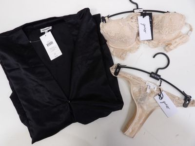 two bras and a pair of panties are on a hanger