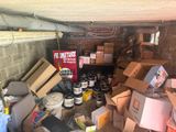 a pile of boxes and other items in a garage