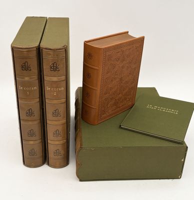three books are stacked on top of each other on a white surface