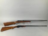 a pair of shotguns on a white background