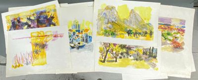 four paintings on display on a table in a room