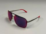 a close up of a pair of sunglasses on a white surface