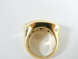 yellow gold ring with diamonds on a white background