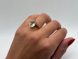 an image of a woman ' s hand with a ring on her finger