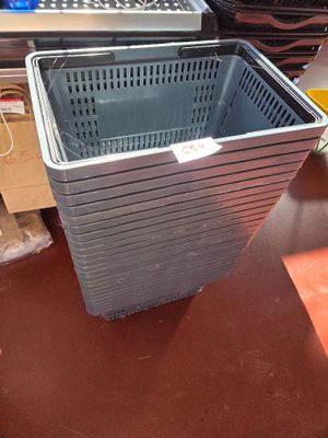 a basket that is sitting on the floor next to a laptop