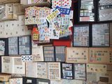 a lot of stamps on the wall of a store