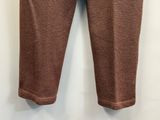 a close up of a pair of brown pants hanging on a wall